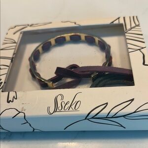 Sseko Gold Bracelet with Plum and Hunter green interchangeable leather ties